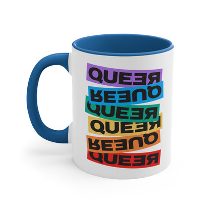 11oz ceramic mug with a blue handle and interior. This mug artistically expresses the word “Queer.” Each variation of the word is black text in a rectangular block and stacked vertically at a slightly different angle than the next row/block. Sometimes “Queer” is backward, sometimes upside down, and sometimes 1-2 letters are backward. The color blocks are purple, blue, green, yellow, and red.