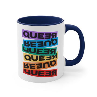 11oz ceramic mug with a navy blue handle and interior. This mug artistically expresses the word “Queer.” Each variation of the word is black text in a rectangular block and stacked vertically at a slightly different angle than the next row/block. Sometimes “Queer” is backward, sometimes upside down, and sometimes 1-2 letters are backward. The color blocks are purple, blue, green, yellow, and red.