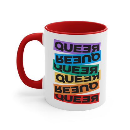 11oz ceramic mug with a red handle and interior. This mug artistically expresses the word “Queer.” Each variation of the word is black text in a rectangular block and stacked vertically at a slightly different angle than the next row/block. Sometimes “Queer” is backward, sometimes upside down, and sometimes 1-2 letters are backward. The color blocks are purple, blue, green, yellow, and red.