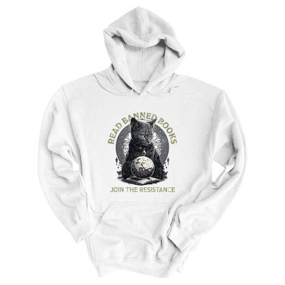 White unisex hoodie with a graphic of a cat sitting over a globe and an open book. The text says “Read banned books” arched over the top of the cat and “Join the resistance” in a line under the graphic. The text is in all caps.