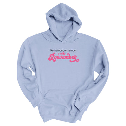 Light Blue color hoodie featuring the phrase 'Remember, Remember the 5th of Roevember'. The text 'The 5th of Roevember' is highlighted in pink, embellished with a decorative script font and additional swooshes.