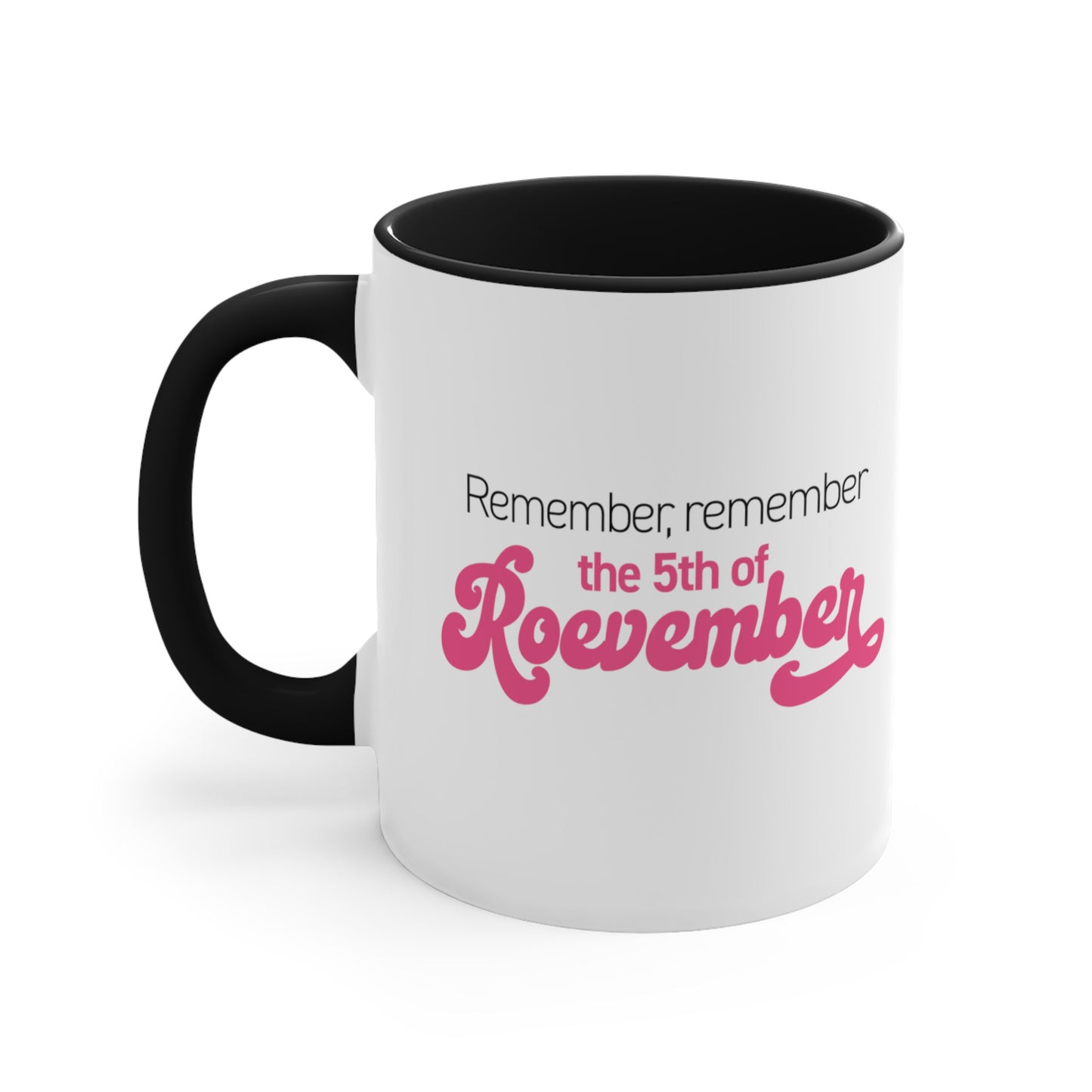 11oz ceramic mug with a black interior and handle featuring the phrase 'Remember, Remember the 5th of Roevember'. The text 'The 5th of Roevember' is highlighted in pink, embellished with a decorative script font and additional swooshes.