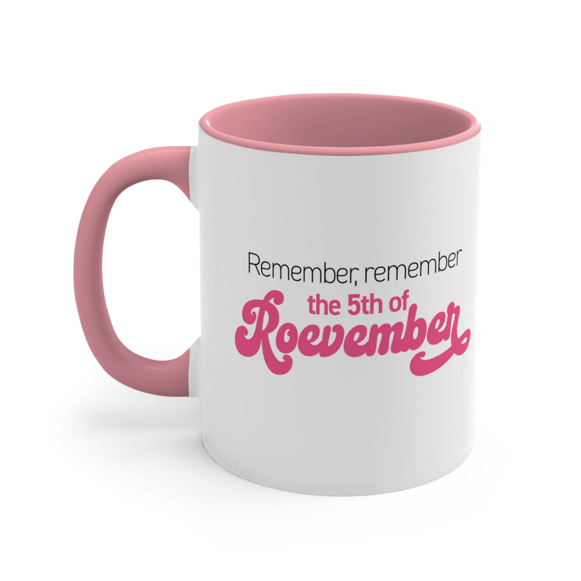 11oz ceramic mug with a pink interior and handle featuring the phrase 'Remember, Remember the 5th of Roevember'. The text 'The 5th of Roevember' is highlighted in pink, embellished with a decorative script font and additional swooshes.