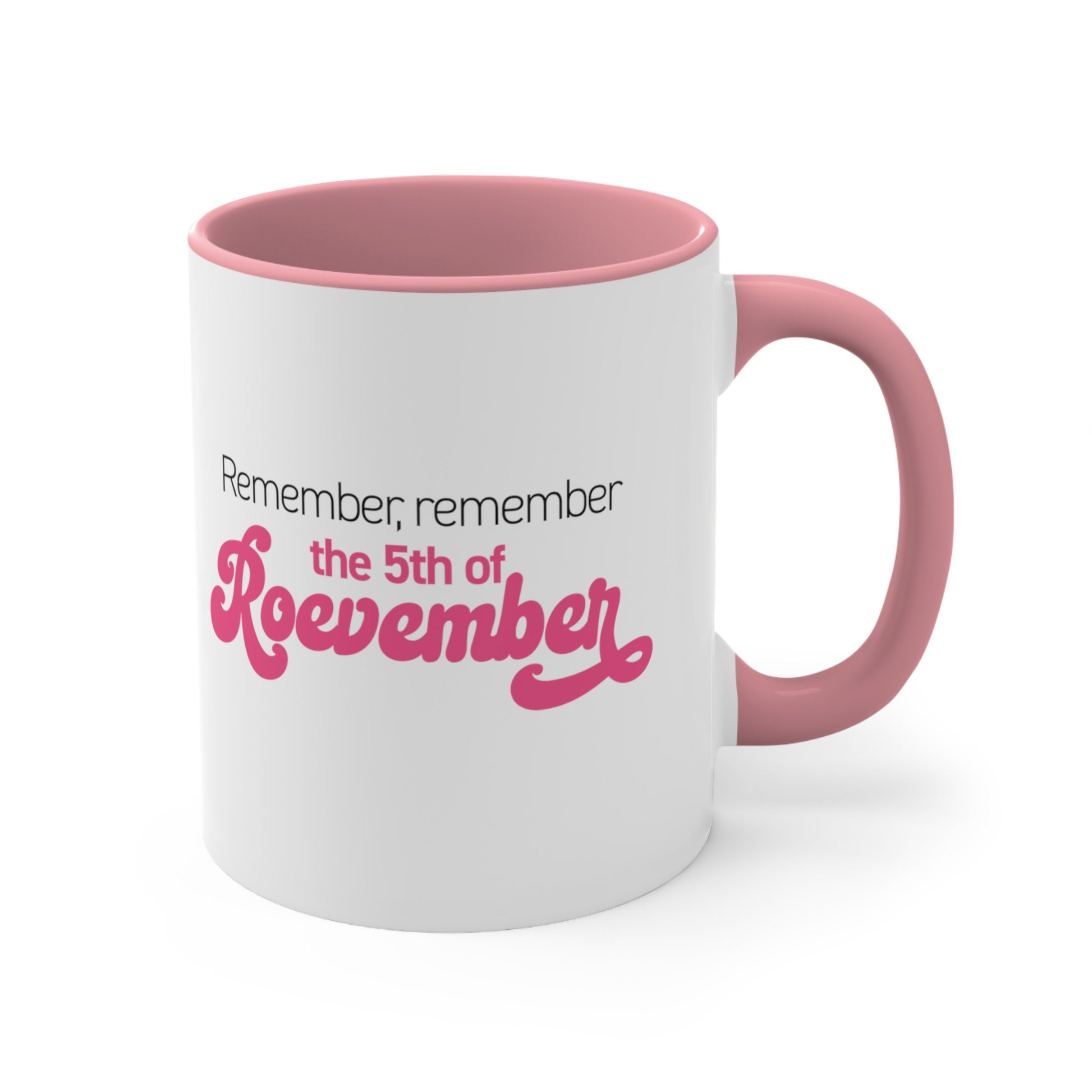 11oz ceramic mug with a pink interior and handle featuring the phrase 'Remember, Remember the 5th of Roevember'. The text 'The 5th of Roevember' is highlighted in pink, embellished with a decorative script font and additional swooshes.