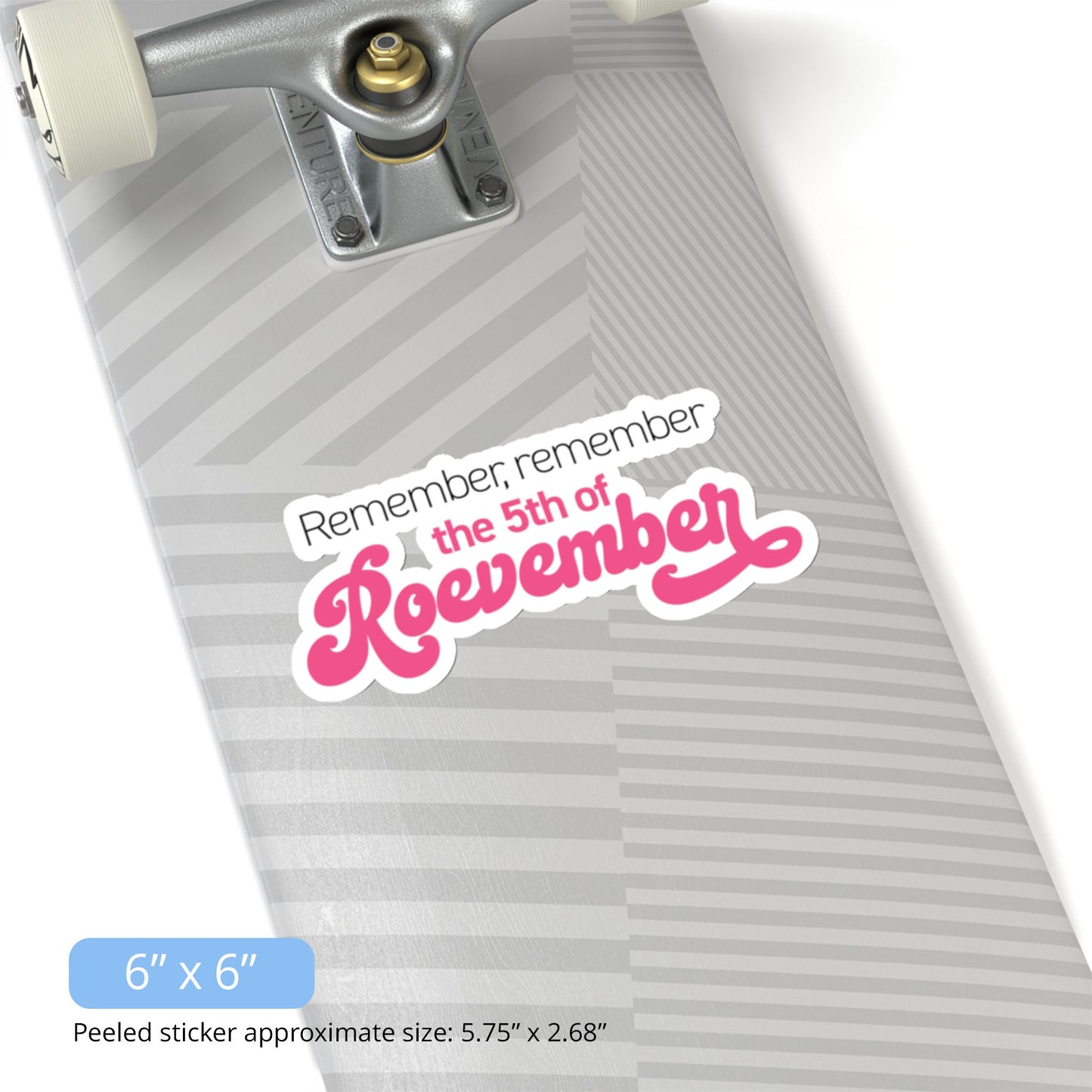 Contextual image of a 6x6 inch (5.75x2.68 inches peeled) indoor sticker featuring the phrase 'Remember, Remember the 5th of Roevember'. The text 'The 5th of Roevember' is highlighted in pink, embellished with a decorative script font and additional swooshes. The sticker is on a skateboard.