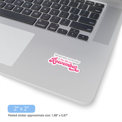 Contextual image of a 2x2inch (1.88x0.87 inches peeled) indoor sticker featuring the phrase 'Remember, Remember the 5th of Roevember'. The text 'The 5th of Roevember' is highlighted in pink, embellished with a decorative script font and additional swooshes. The sticker is on a laptop.