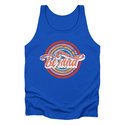 Royal color unisex tank top with a graphic that says “Be Kind.” There is a retro-colored circular rainbow behind it. The text is outlined in white and has a long swoosh that swirls from the end of the letter “d” across the entire word “kind.”