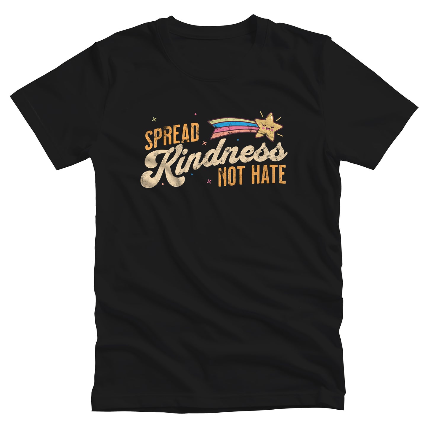 Black unisex t-shirt with a graphic that says “Spread Kindness Not Hate” with an illustration of a rainbow shooting star over the word “kindness.” That word is in a script font, and the rest is a regular font in all caps. ”Spread” is on top of the word “Kindness” and aligned left, while “Not Hate” is below the word “kindness” and aligned to the right.