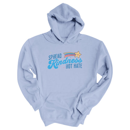 Light Blue unisex hoodie with a graphic that says “Spread Kindness Not Hate” with an illustration of a rainbow shooting star over the word “kindness.” That word is in a script font, and the rest is a regular font in all caps. ”Spread” is on top of the word “Kindness” and aligned left, while “Not Hate” is below the word “kindness” and aligned to the right.