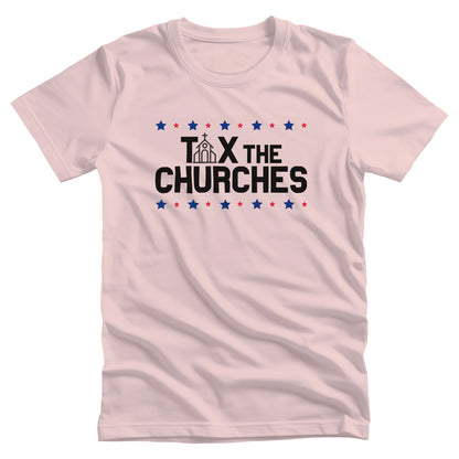 Soft Pink color unisex t-shirt featuring bold text that reads 'TAX THE CHURCHES,' with the letter 'A' in 'TAX' depicted as a church illustration. Alternating blue and red stars decorate the phrase above and below.