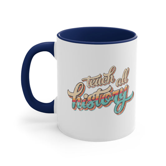 11oz ceramic mug with a navy blue interior and handle that says, “Teach all history" in retro colors and a script font. The text is slightly angled upwards, with the word "history" being larger than "teach all".