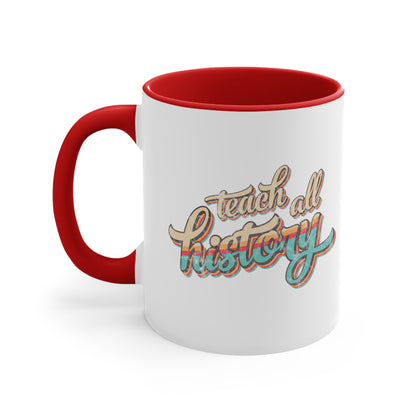 11oz ceramic mug with a red interior and handle that says, “Teach all history" in retro colors and a script font. The text is slightly angled upwards, with the word "history" being larger than "teach all".