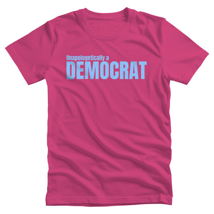 Berry color unisex t-shirt that says, “Unapologetically a Democrat” in all caps. The words “Unapologetically a” are a smaller font size on their own line. The word “Democrat” is beneath that and spans across the chest.